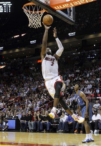 James y Wade llevan al Heat a victoria sobre Wizards
