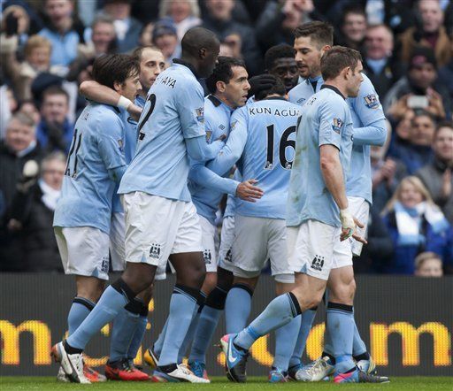 Tevez y Toure dan la victoria a Manchester City