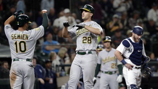 Atléticos acecha a Yanquis gracias a grand slam de Olson